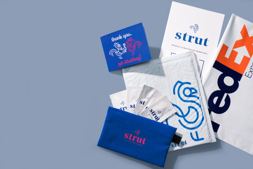 Flatlay photography showing Strut packaging, shipping, and branding. 