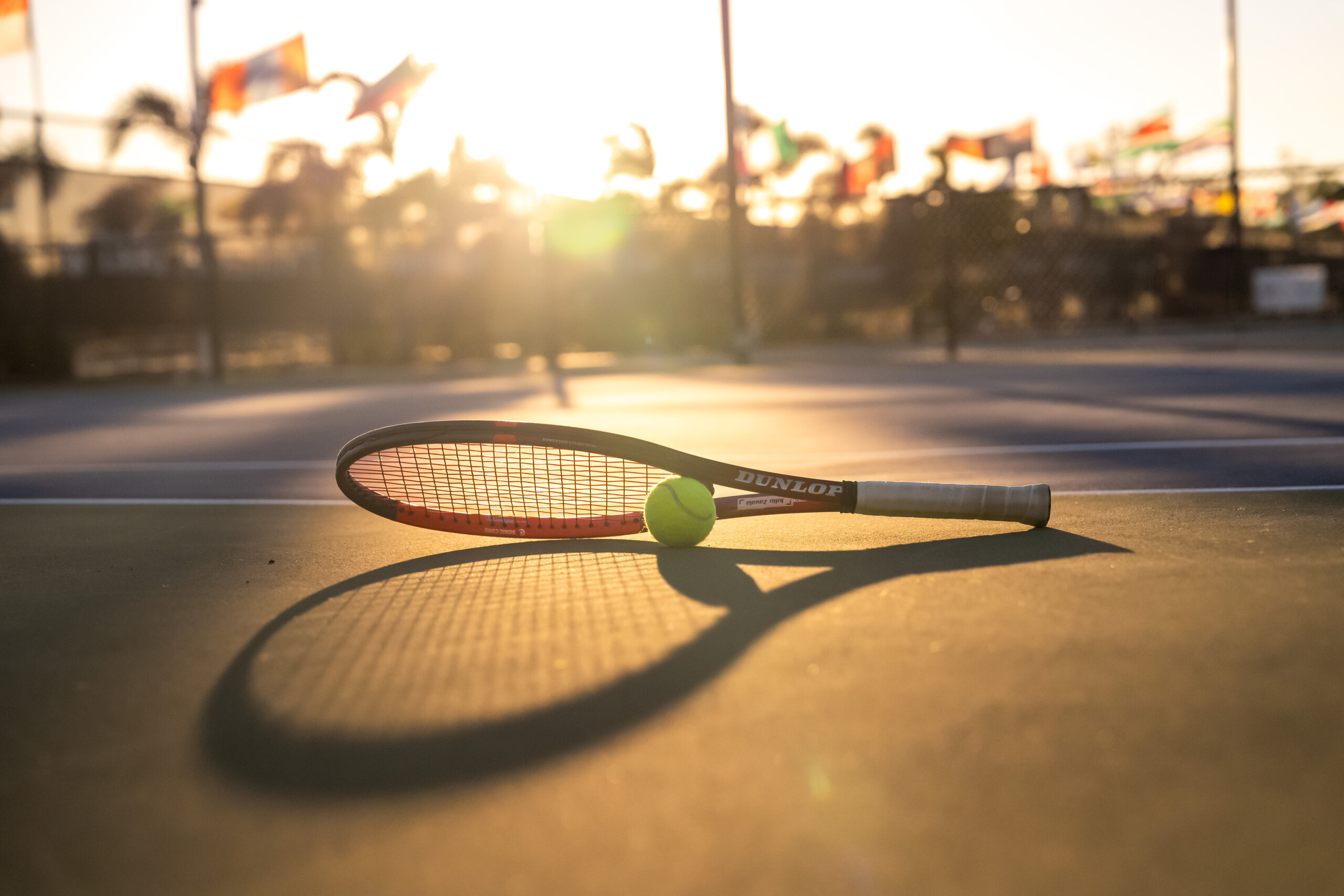 Dunlop Tennis promotional visuals featuring aerial footage, photography, and polished video production.