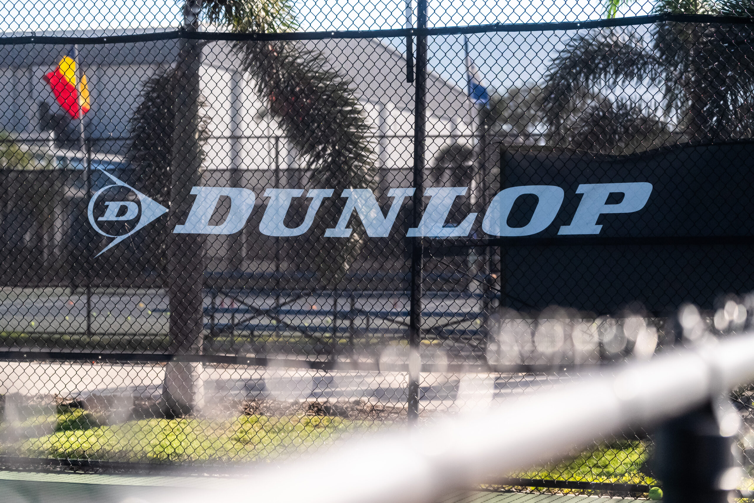Professional video production and photography showcasing Dunlop Tennis branding.