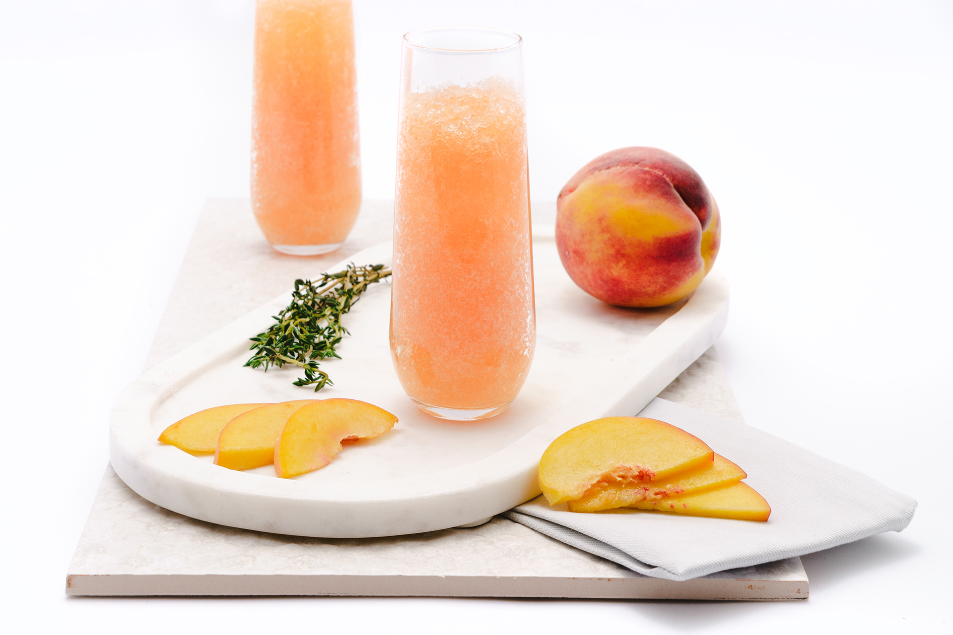 Product photography of a peach drink placed on a clean white backdrop, captured in Amazon-style photography format. High-quality, detailed product image designed for e-commerce platforms like Amazon, showcasing clarity and professionalism.