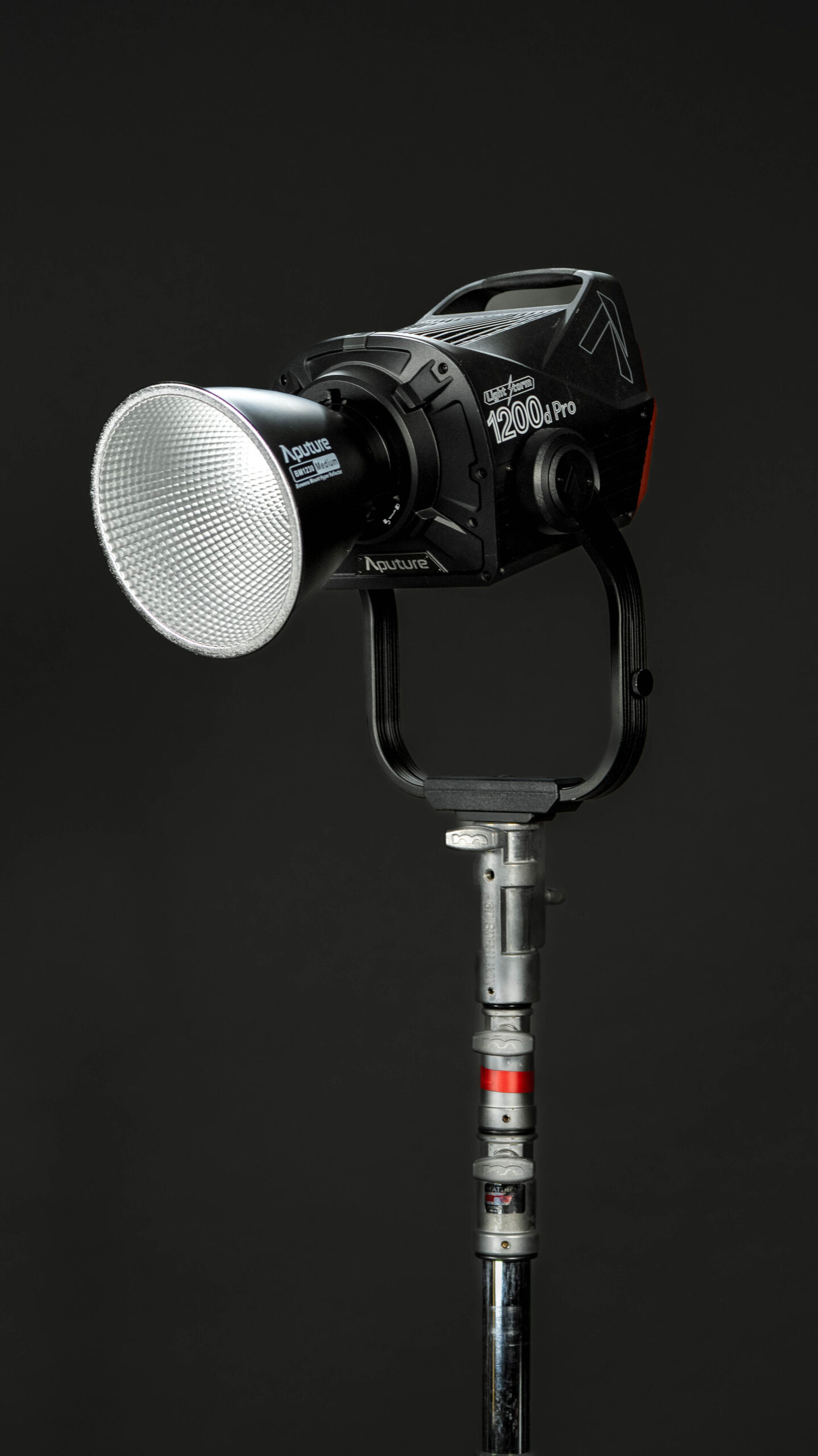 Aputure 1200d Pro daylight LED light set up outdoors on a heavy-duty stand.